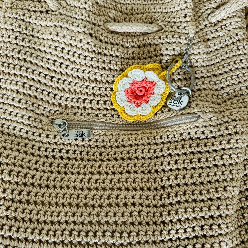 The Sak crochet drawstring backpack with zip pocket